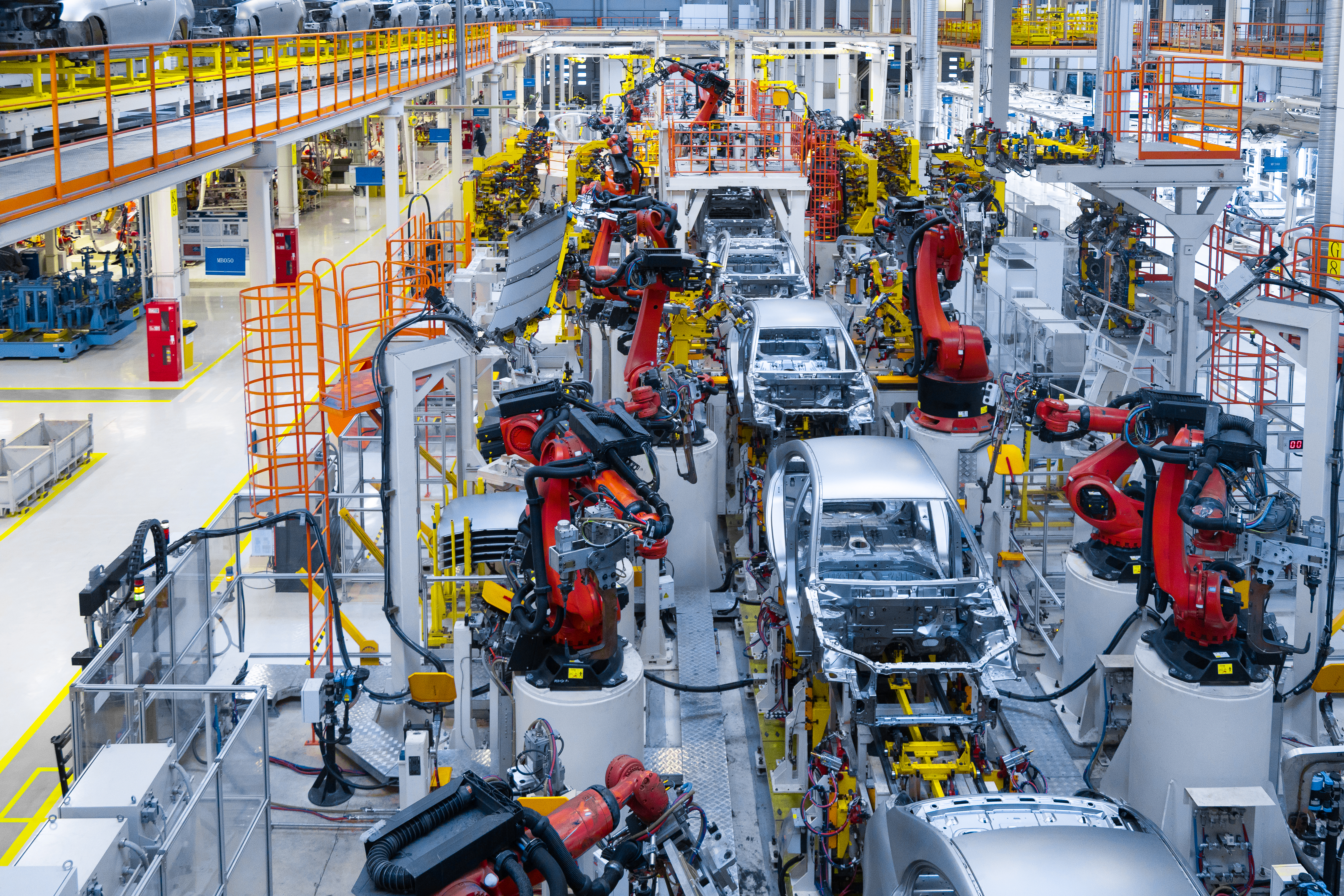  a large area of new cars waiting to go to the dealerships
