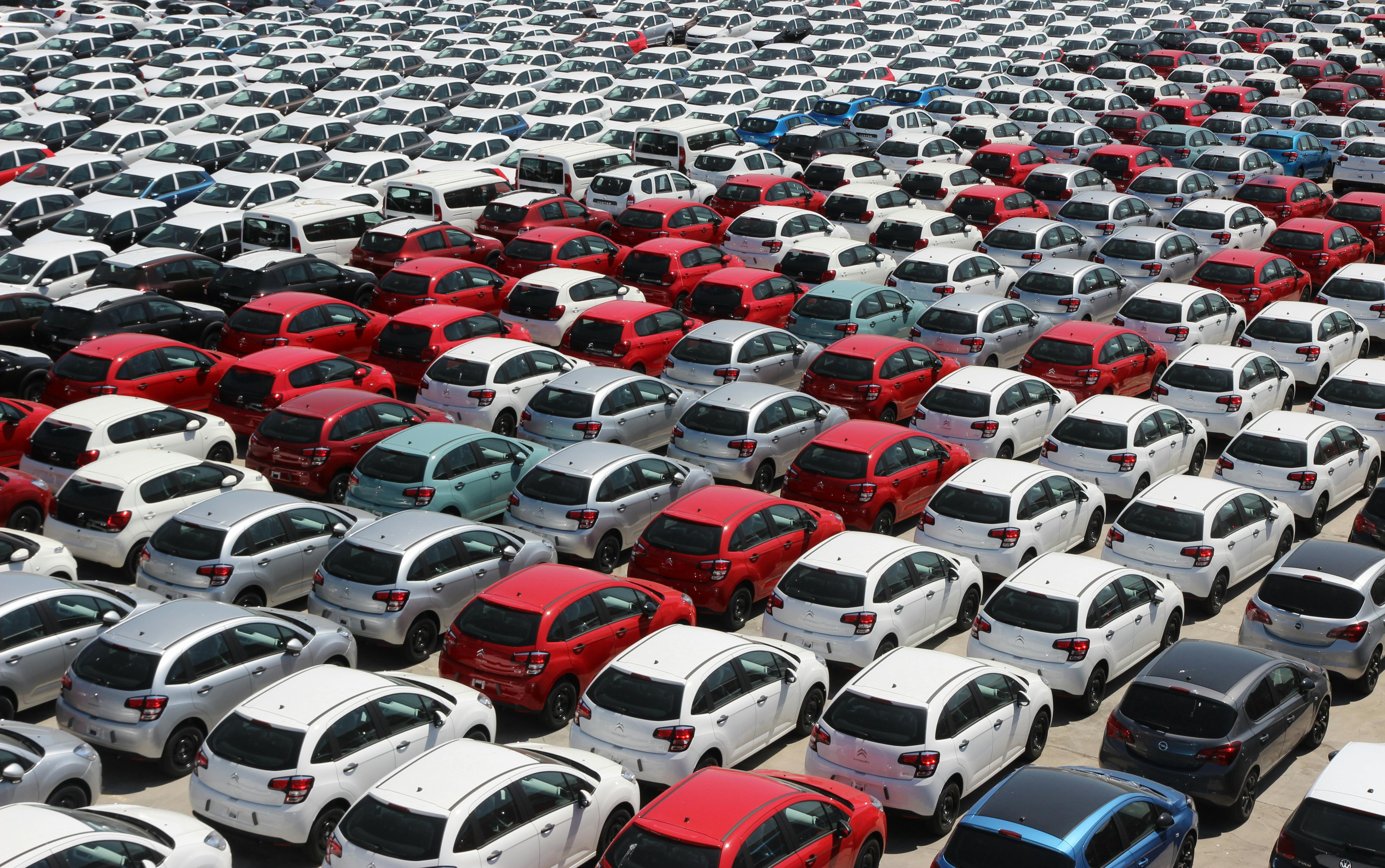  a large area of new cars waiting to go to the dealerships